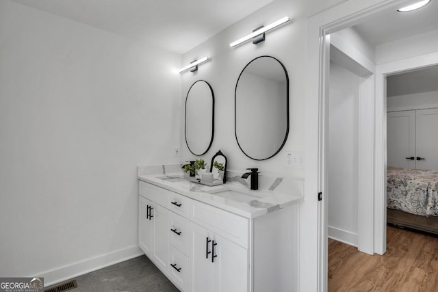 bathroom featuring hardwood / wood-style floors and vanity