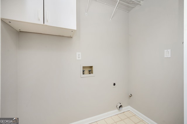 laundry room with electric dryer hookup, gas dryer hookup, cabinets, and washer hookup