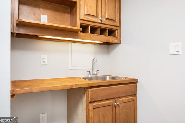 kitchen featuring butcher block counters and sink