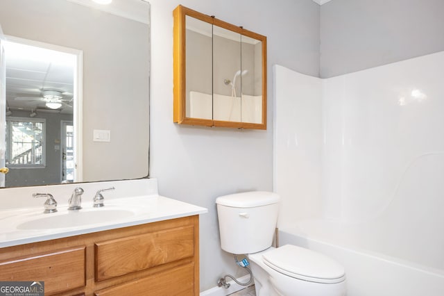 full bathroom with ceiling fan, toilet, vanity, and bathing tub / shower combination