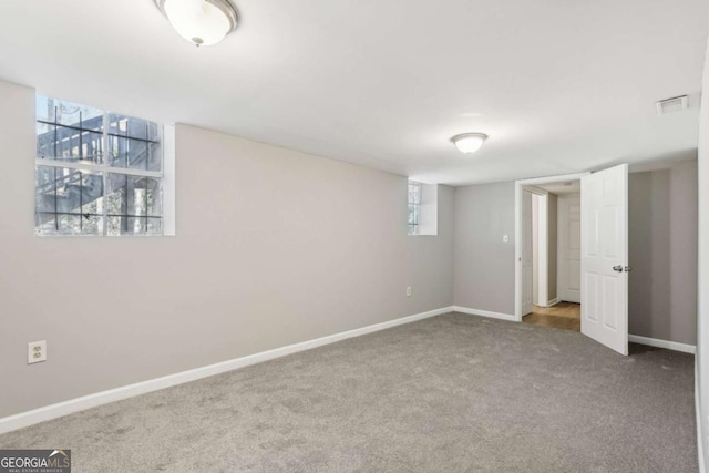 interior space featuring carpet, visible vents, and baseboards