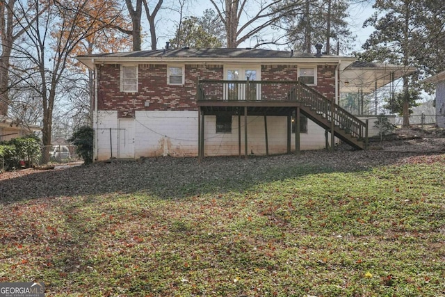 back of property featuring brick siding, fence, stairway, and a wooden deck