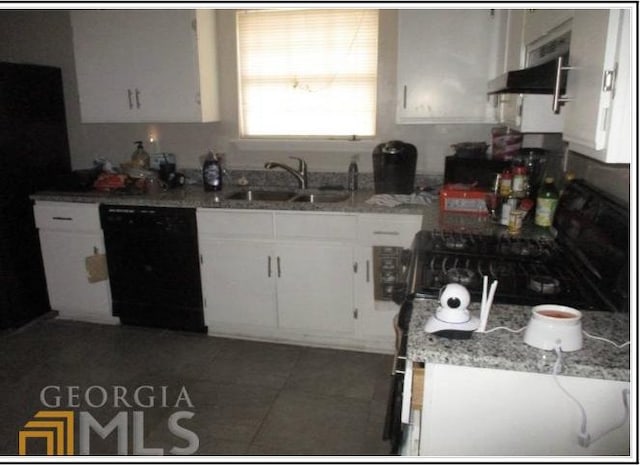 kitchen with dishwasher, white cabinets, light stone countertops, and sink