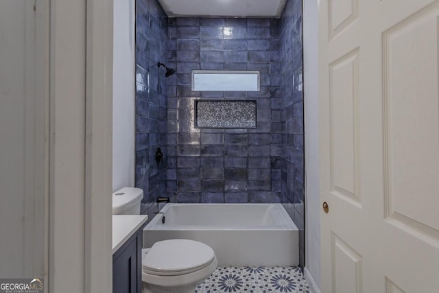 full bathroom with tile patterned floors, vanity, toilet, and tiled shower / bath