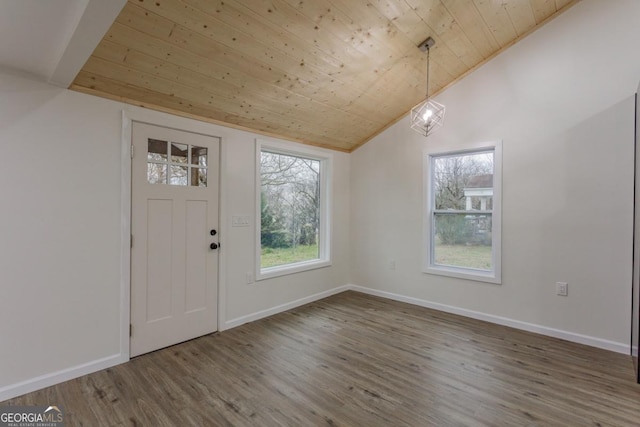 entryway with hardwood / wood-style flooring, vaulted ceiling, a notable chandelier, and wood ceiling