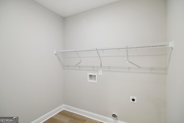 laundry room with wood-type flooring, washer hookup, and hookup for an electric dryer