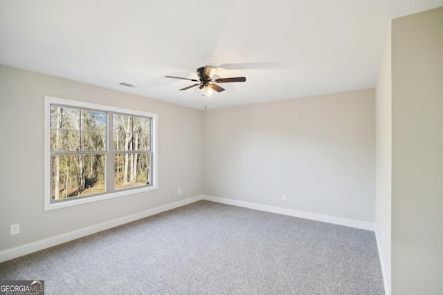 carpeted empty room with ceiling fan