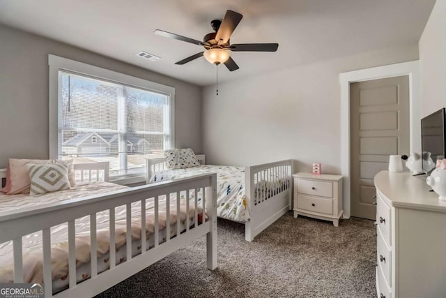 carpeted bedroom with ceiling fan