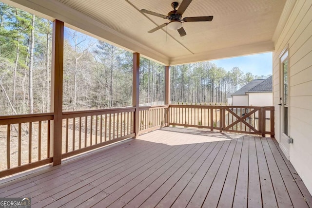 wooden terrace with ceiling fan