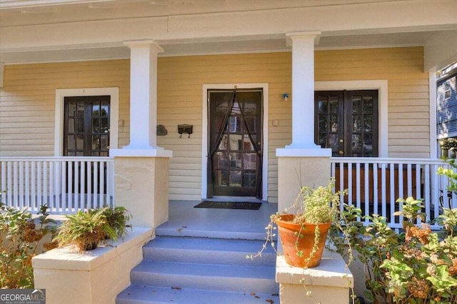 property entrance featuring a porch