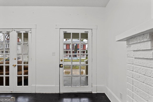 doorway to outside featuring hardwood / wood-style flooring and french doors