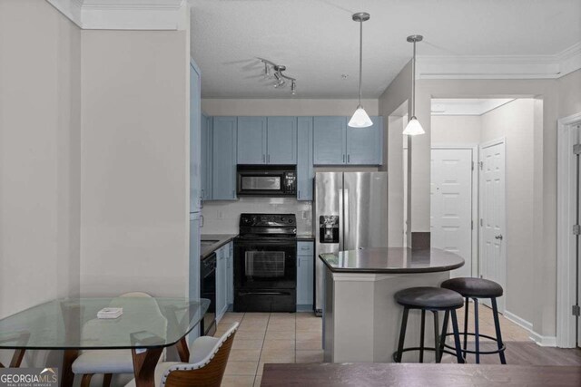 kitchen featuring a kitchen breakfast bar, blue cabinets, black appliances, light tile patterned floors, and decorative light fixtures