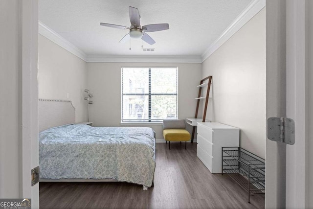 bedroom featuring wood-type flooring, ceiling fan, and ornamental molding