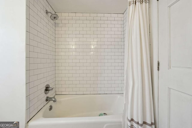 bathroom with shower / tub combo with curtain