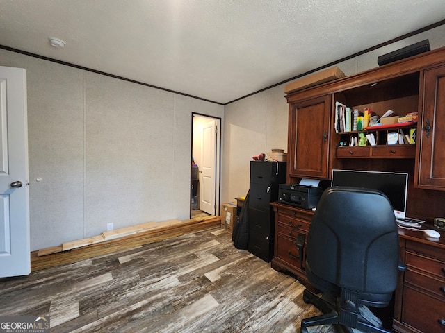 home office featuring a textured ceiling and dark hardwood / wood-style floors