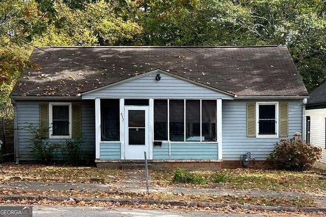 view of front of property with a sunroom