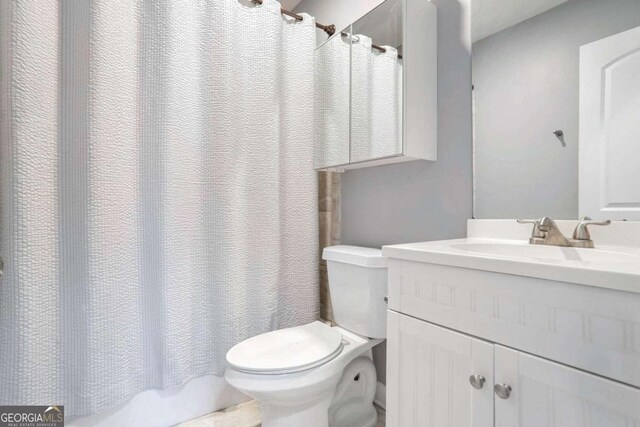 bathroom with vanity and toilet