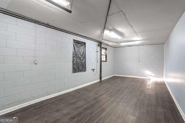 basement featuring dark wood-type flooring