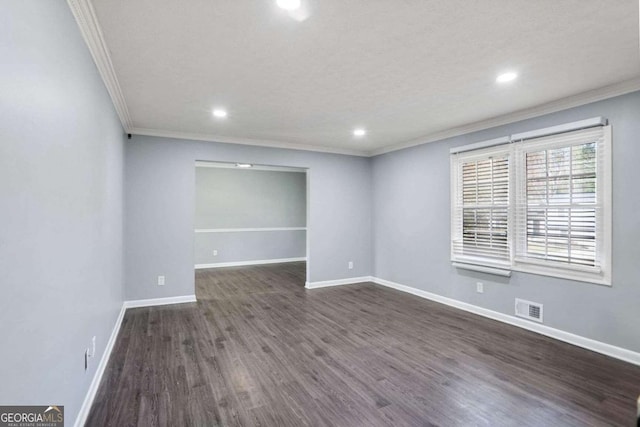 unfurnished room with dark hardwood / wood-style floors and ornamental molding