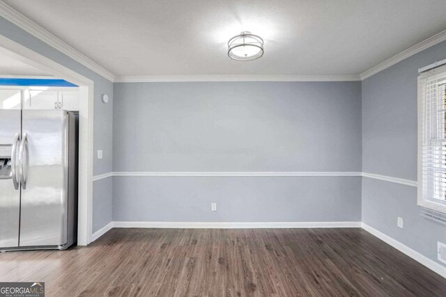 unfurnished dining area with a wealth of natural light, crown molding, and dark hardwood / wood-style floors