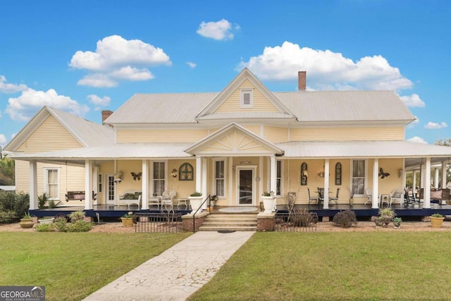 country-style home with a front yard