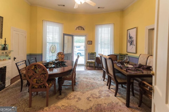 610 W Liberty, Claxton, GA 30417 - dining room with ceiling fan, crown molding, and a fireplace