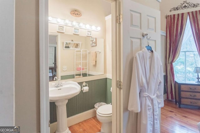 610 W Liberty, Claxton, GA 30417 - bathroom with hardwood / wood-style floors and toilet