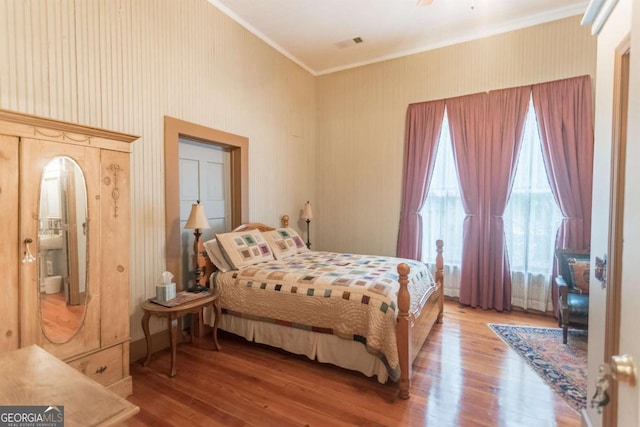 610 W Liberty, Claxton, GA 30417 - bedroom featuring hardwood / wood-style floors and ornamental molding