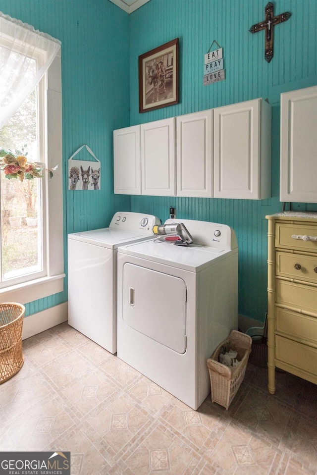 610 W Liberty, Claxton, GA 30417 - washroom featuring a healthy amount of sunlight, washer and clothes dryer, and cabinets
