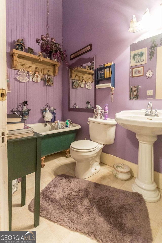 610 W Liberty, Claxton, GA 30417 - bathroom featuring tile patterned flooring and toilet