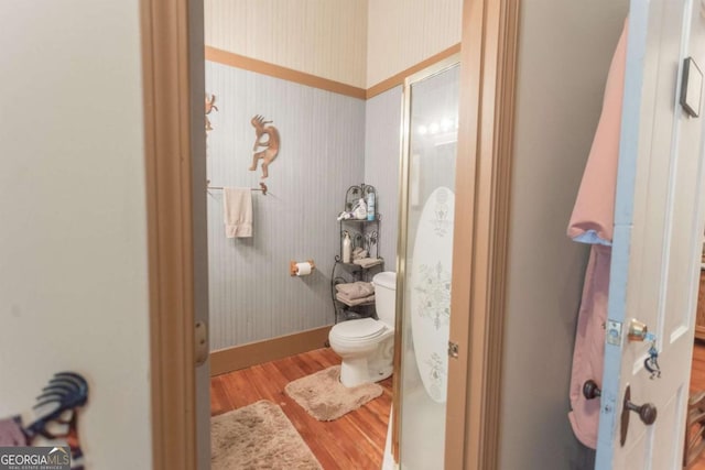 610 W Liberty, Claxton, GA 30417 - bathroom with hardwood / wood-style flooring and toilet