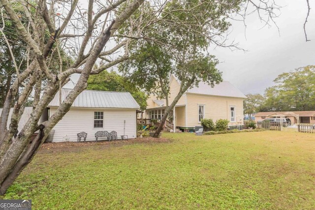 610 W Liberty, Claxton, GA 30417 - back of house with a lawn
