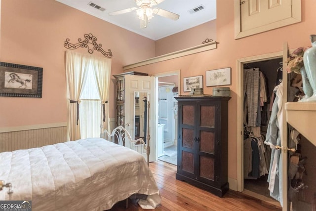 610 W Liberty, Claxton, GA 30417 - bedroom with ensuite bathroom, ceiling fan, and light hardwood / wood-style floors