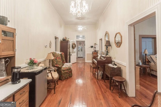 610 W Liberty, Claxton, GA 30417 - corridor with wood-type flooring and an inviting chandelier