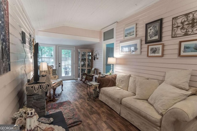 610 W Liberty, Claxton, GA 30417 - living room featuring wooden walls, dark hardwood / wood-style flooring, crown molding, and lofted ceiling