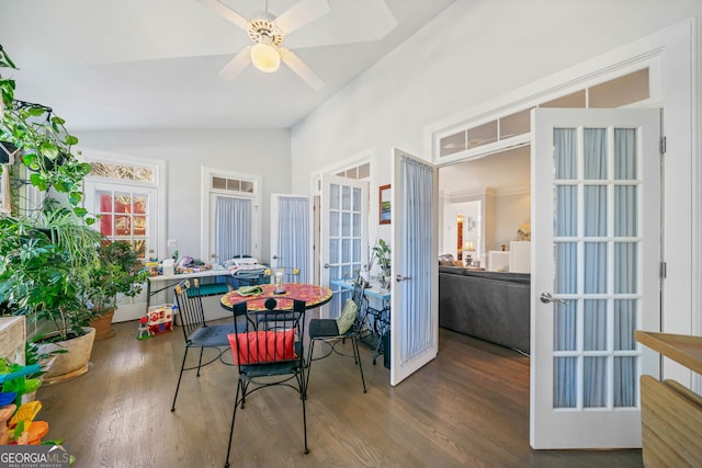 dining area with french doors, hardwood / wood-style flooring, ceiling fan, and lofted ceiling