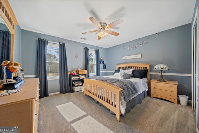 bedroom featuring light colored carpet and ceiling fan