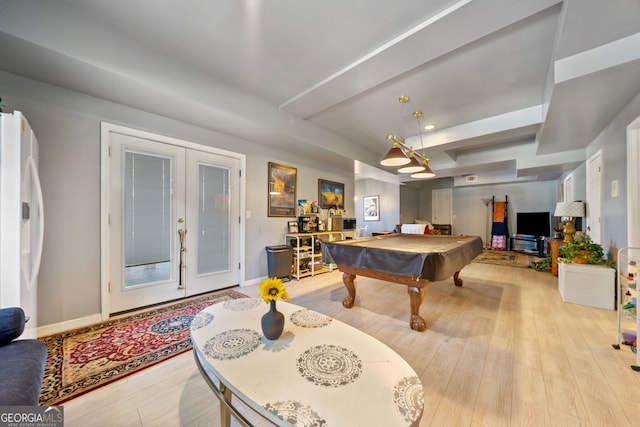 recreation room featuring french doors, light wood-type flooring, and pool table