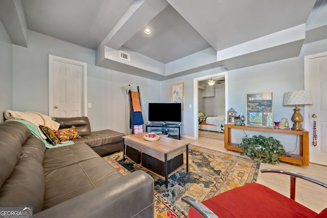 living room featuring ceiling fan and wood-type flooring