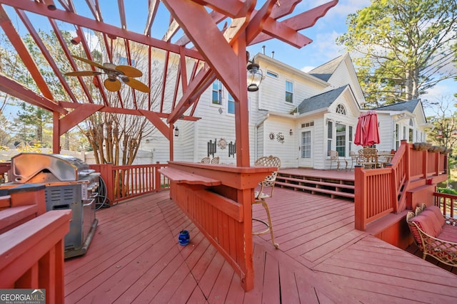 deck featuring a grill and ceiling fan