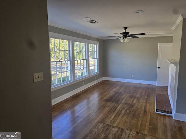 unfurnished living room featuring ceiling fan, dark hardwood / wood-style flooring, and crown molding