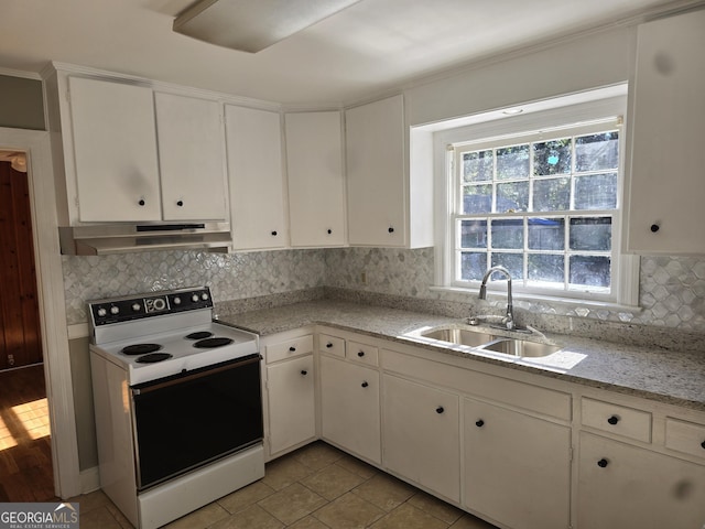 kitchen featuring white cabinets, white electric range, sink, light tile patterned flooring, and light stone counters