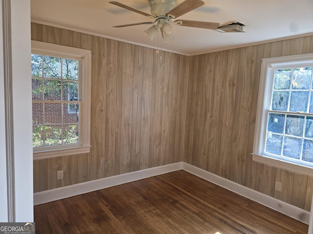 unfurnished room with ceiling fan and ornamental molding