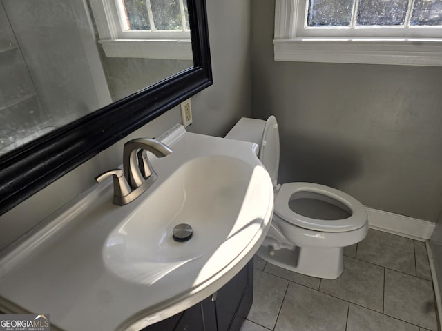 bathroom featuring tile patterned floors, sink, and toilet