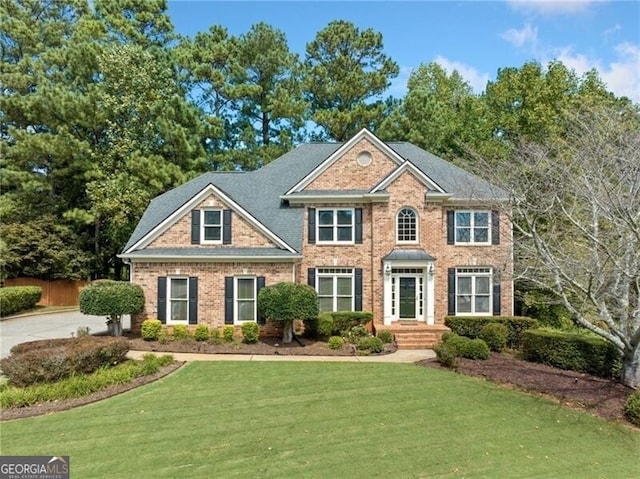 colonial home with a front yard