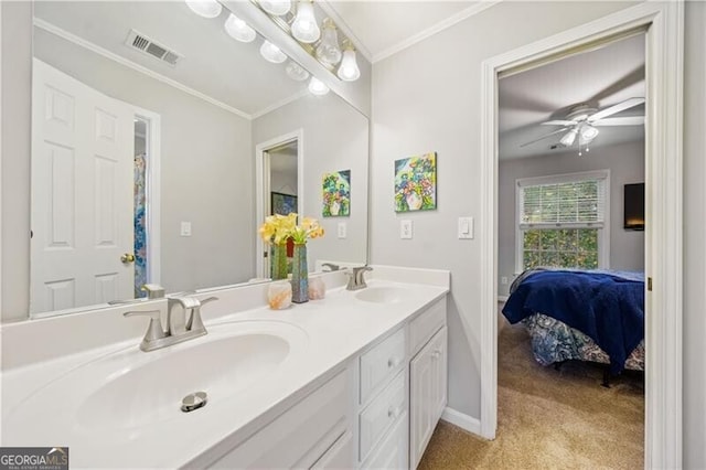 bathroom with ceiling fan, ornamental molding, and vanity