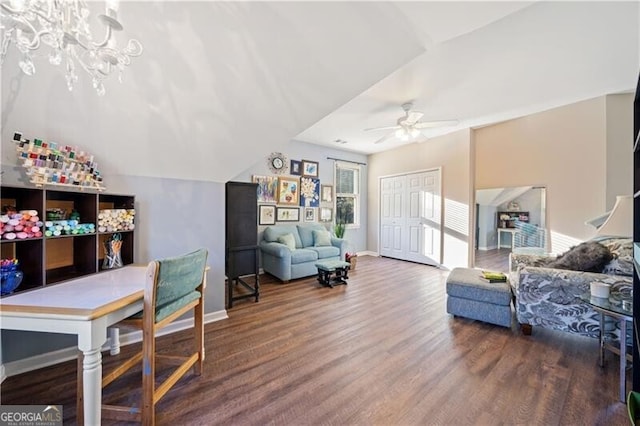 living room with wood-type flooring, ceiling fan, and lofted ceiling