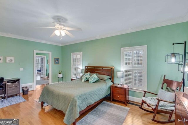 bedroom with ceiling fan, light hardwood / wood-style floors, and ornamental molding