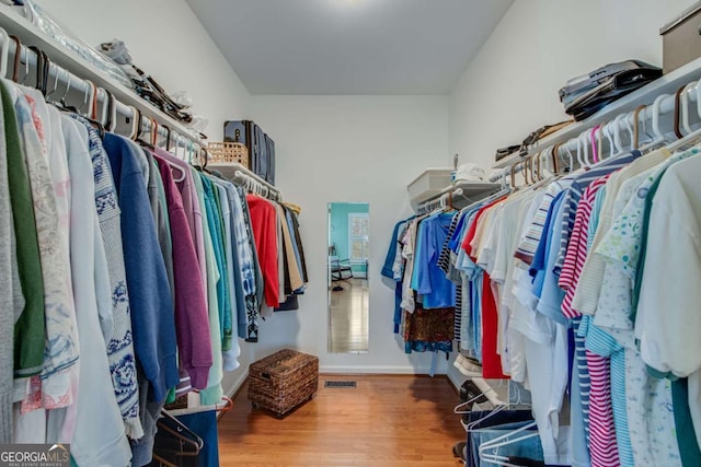 walk in closet featuring hardwood / wood-style floors