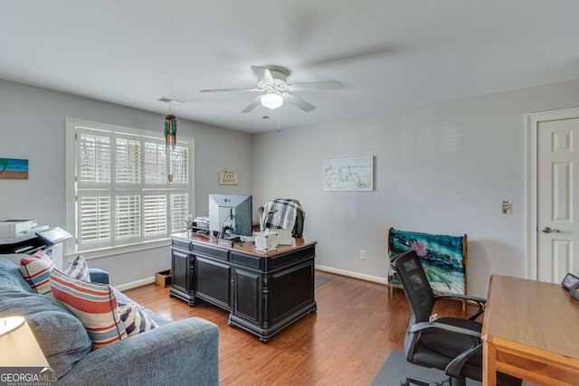 office area with hardwood / wood-style floors and ceiling fan